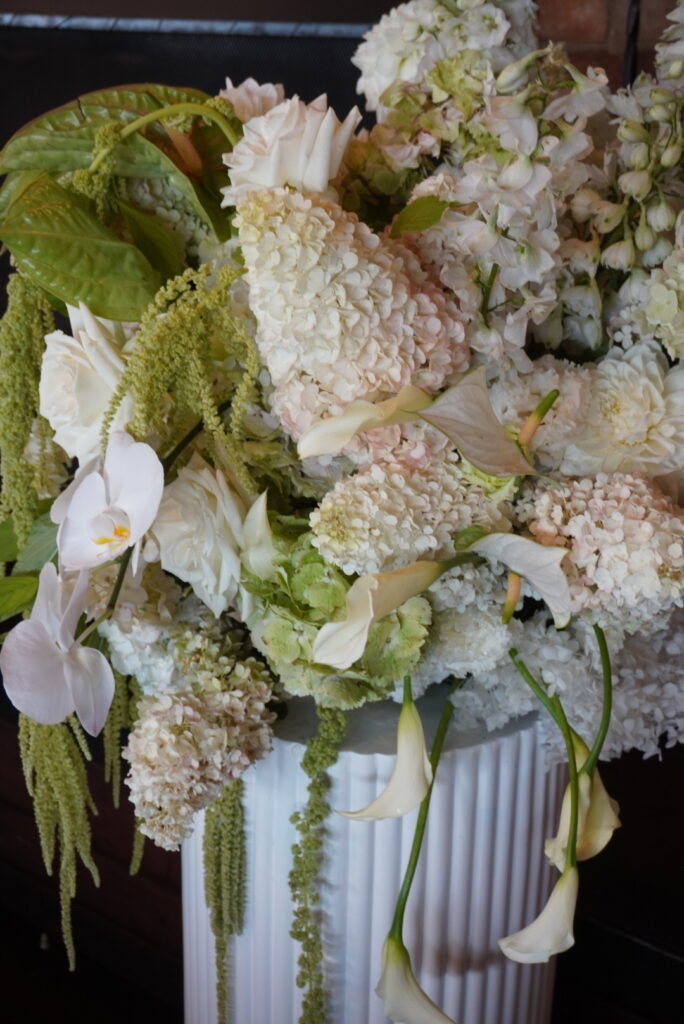 Pale floral arrangement with hydrangea and orchid