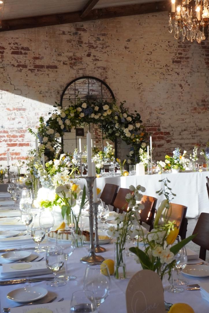 Spring tablescape with a floral arch by Sugar Bee Flowers at The Stables, Stones of the Yarra Valley