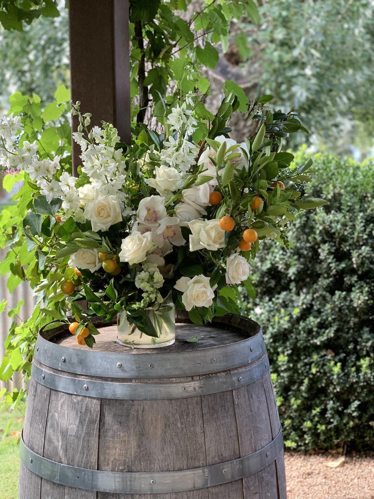 Seasonal white and citrus arrangement by Sugar Bee Flowers, made by hand in the Coldstream studio